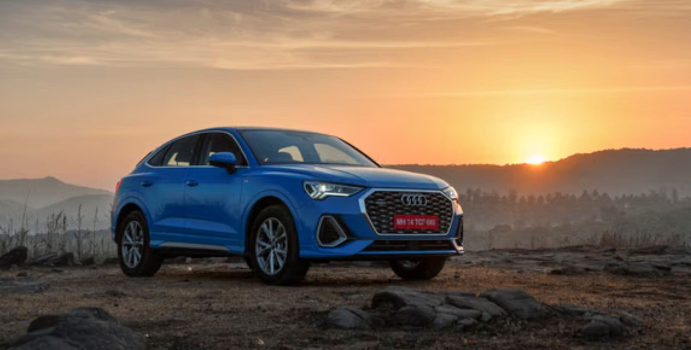 2025 Audi Q3 Quattro luxury compact SUV shown in profile for review. Performance/action shot